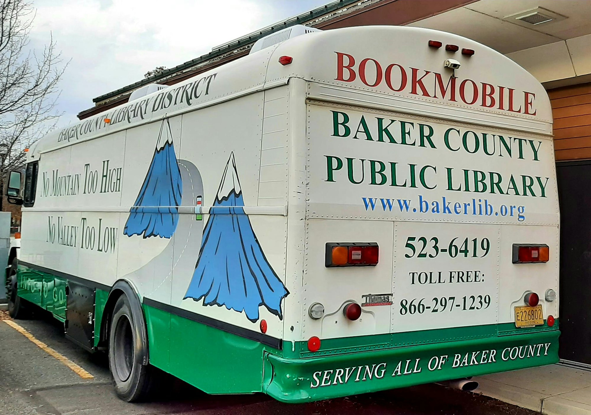 Baker County Public Library bookmobile with slogans and contact information.