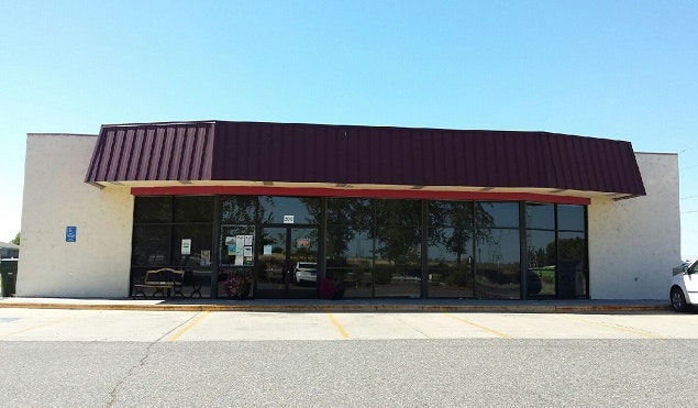 Image of front of library and parking lot