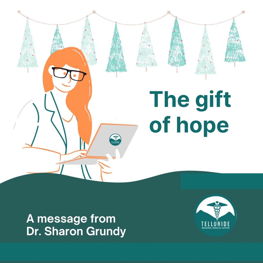 Illustration of a doctor with glasses and a laptop, festive trees, text: "The gift of hope," Telluride Medical Center logo.