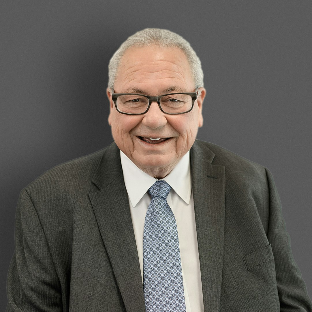 James Emmons- formal wear, tie, face, head, person, photography, portrait, happy, smile, clothing, suit, adult, male, man, glasses, and necktie