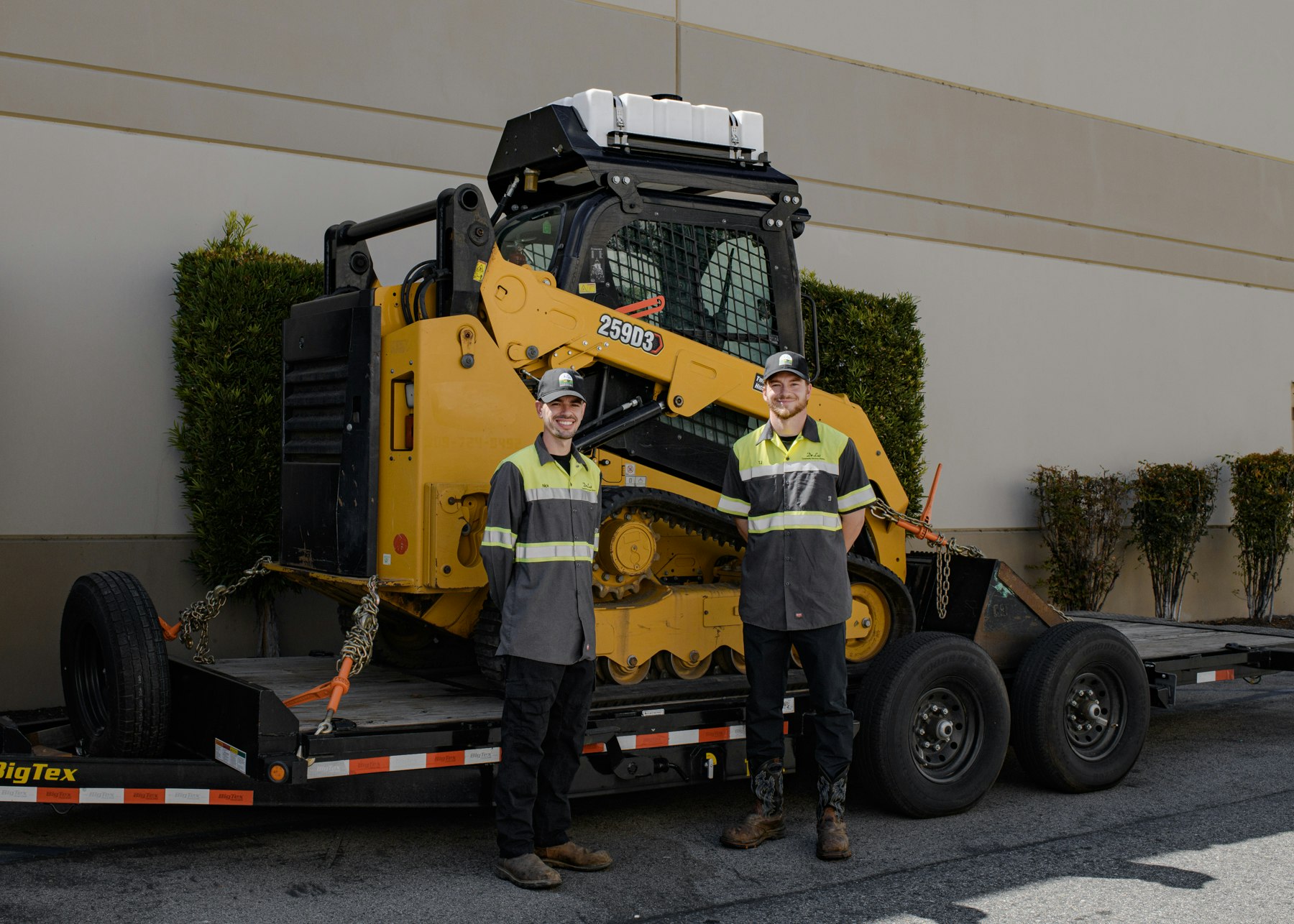 May contain: person, worker, clothing, hardhat, helmet, hat, footwear, shoe, adult, male, man, tire, machine, and wheel