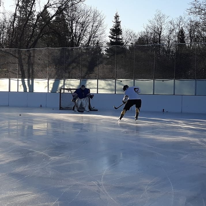 May contain: person, human, skating, rink, ice skating, sport, and sports