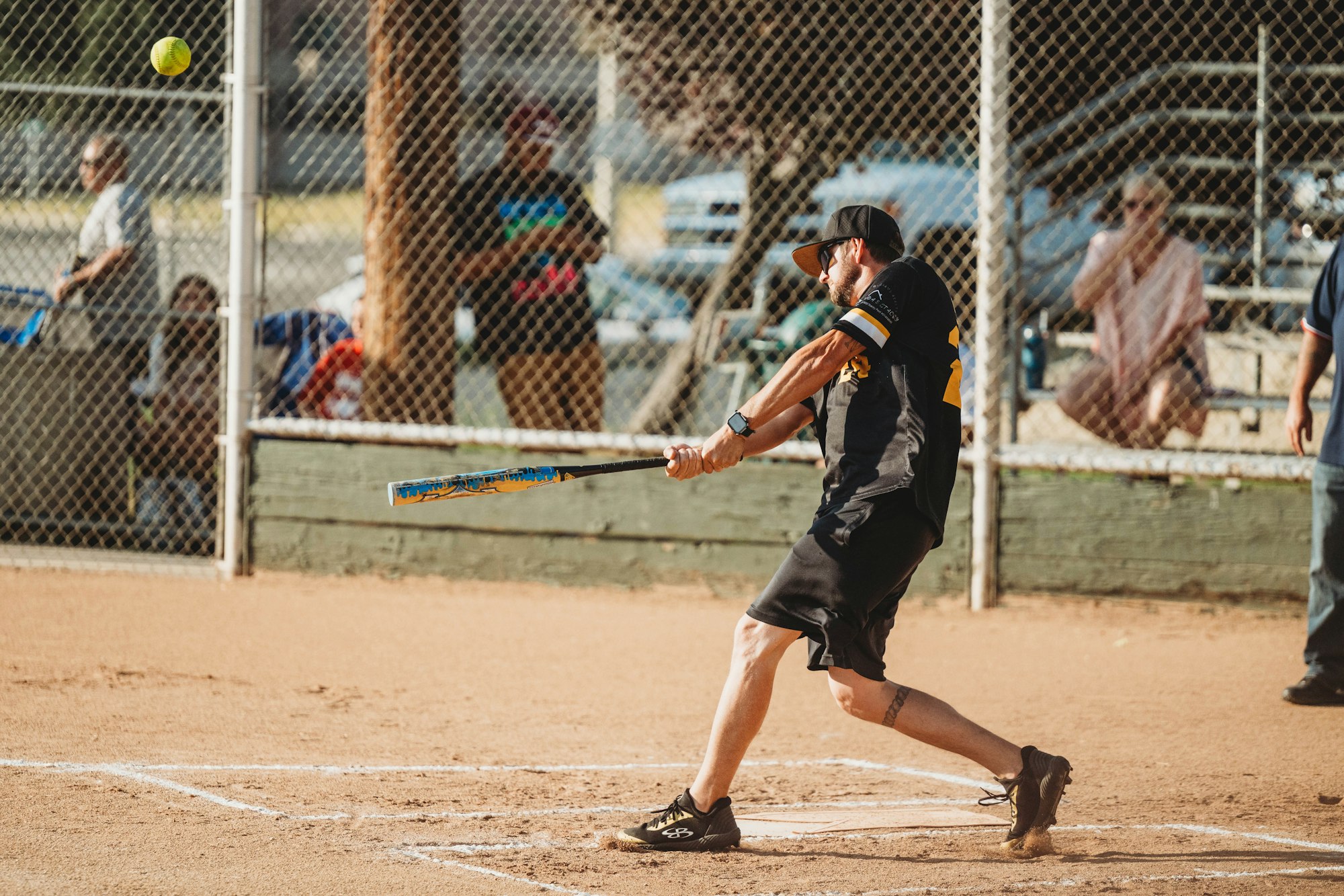 A baseball player swinging at a pitch during a game.