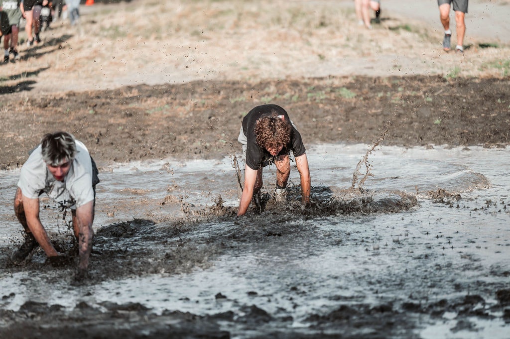 May contain: person, clothing, shorts, and mud