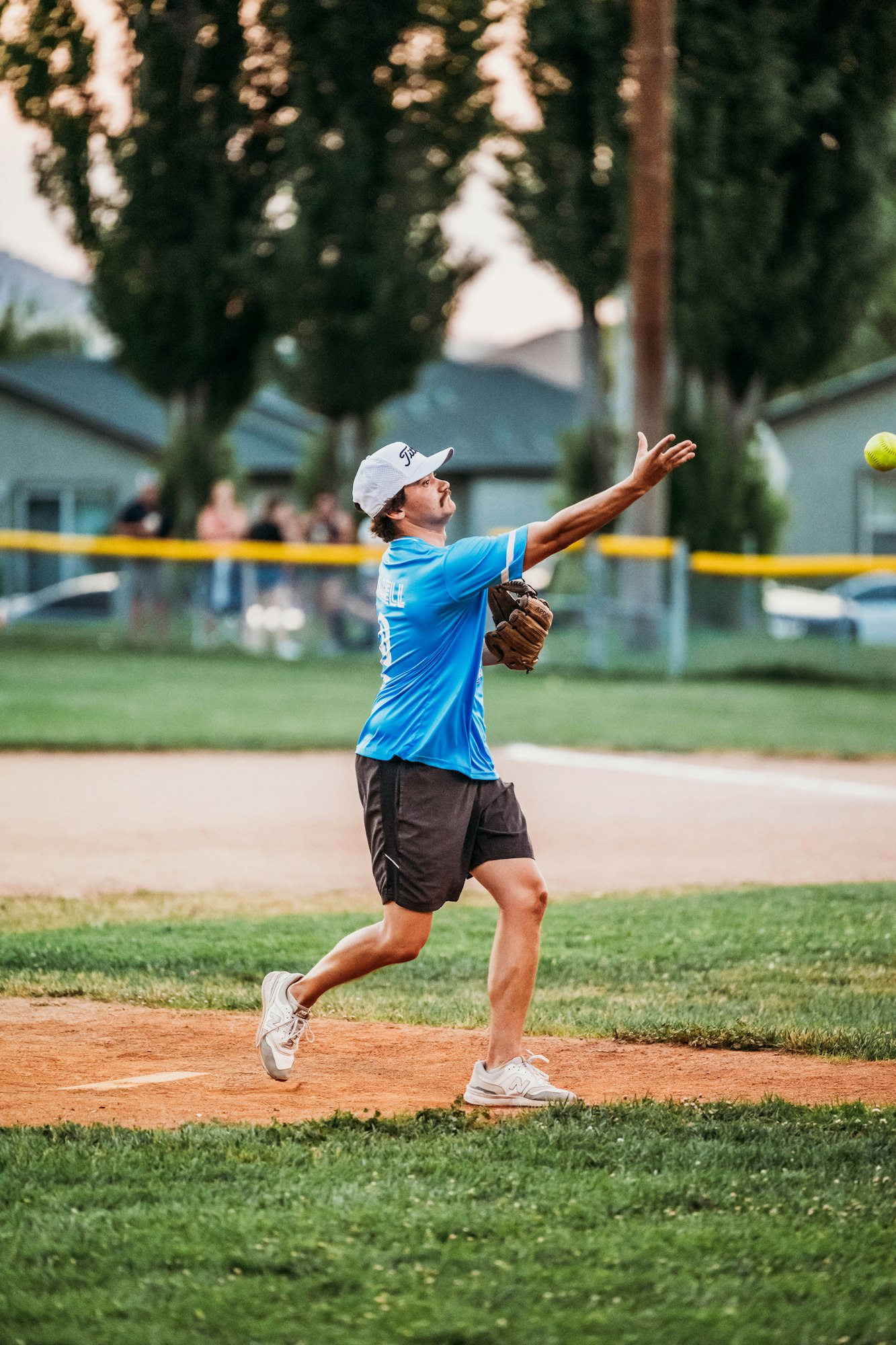 A baseball player throwing the ball on a field.