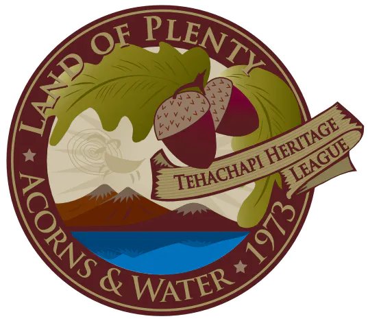 Seal with acorns, mountains, water, and text: "Land of Plenty, Acorns & Water, 1973, Tehachapi Heritage League."
