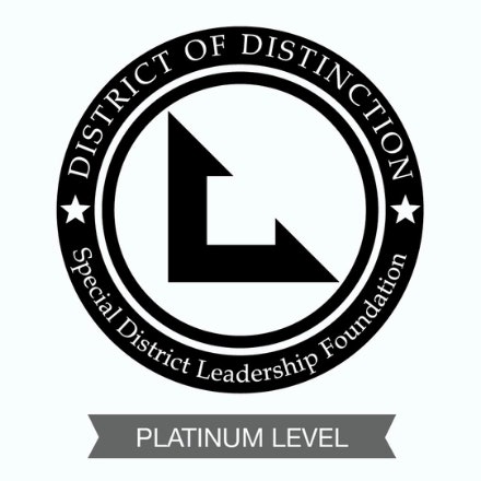 A black and white seal for the "District of Distinction" from the Special District Leadership Foundation, indicating a "Platinum Level" award.