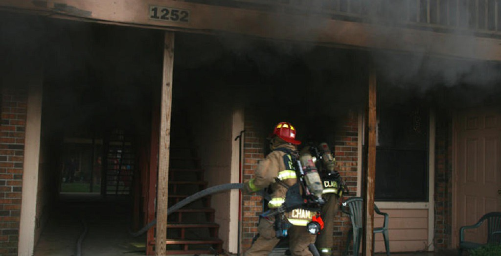 Photo of firefighter and a building