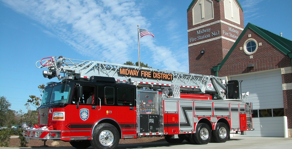 Photo of a fire engine and a station