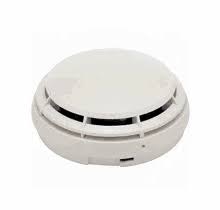 A white smoke detector.