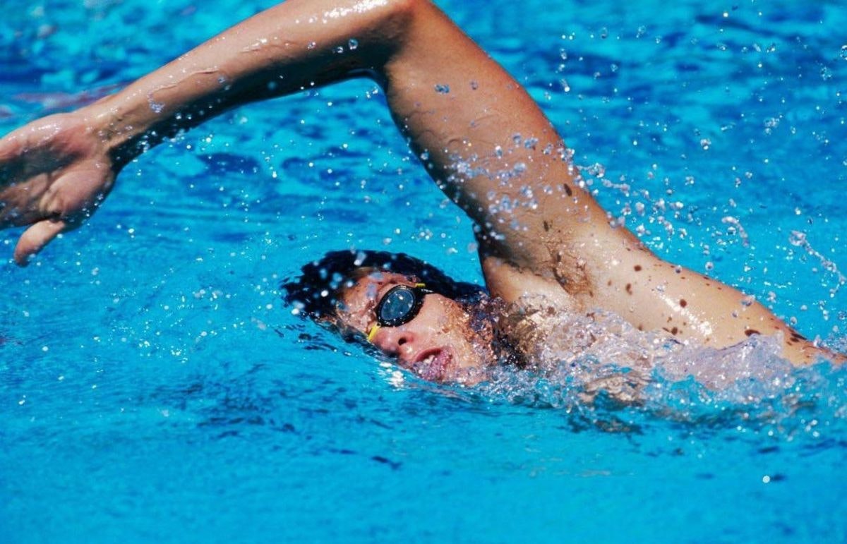 May contain: swimming, sport, person, water, sports, and human