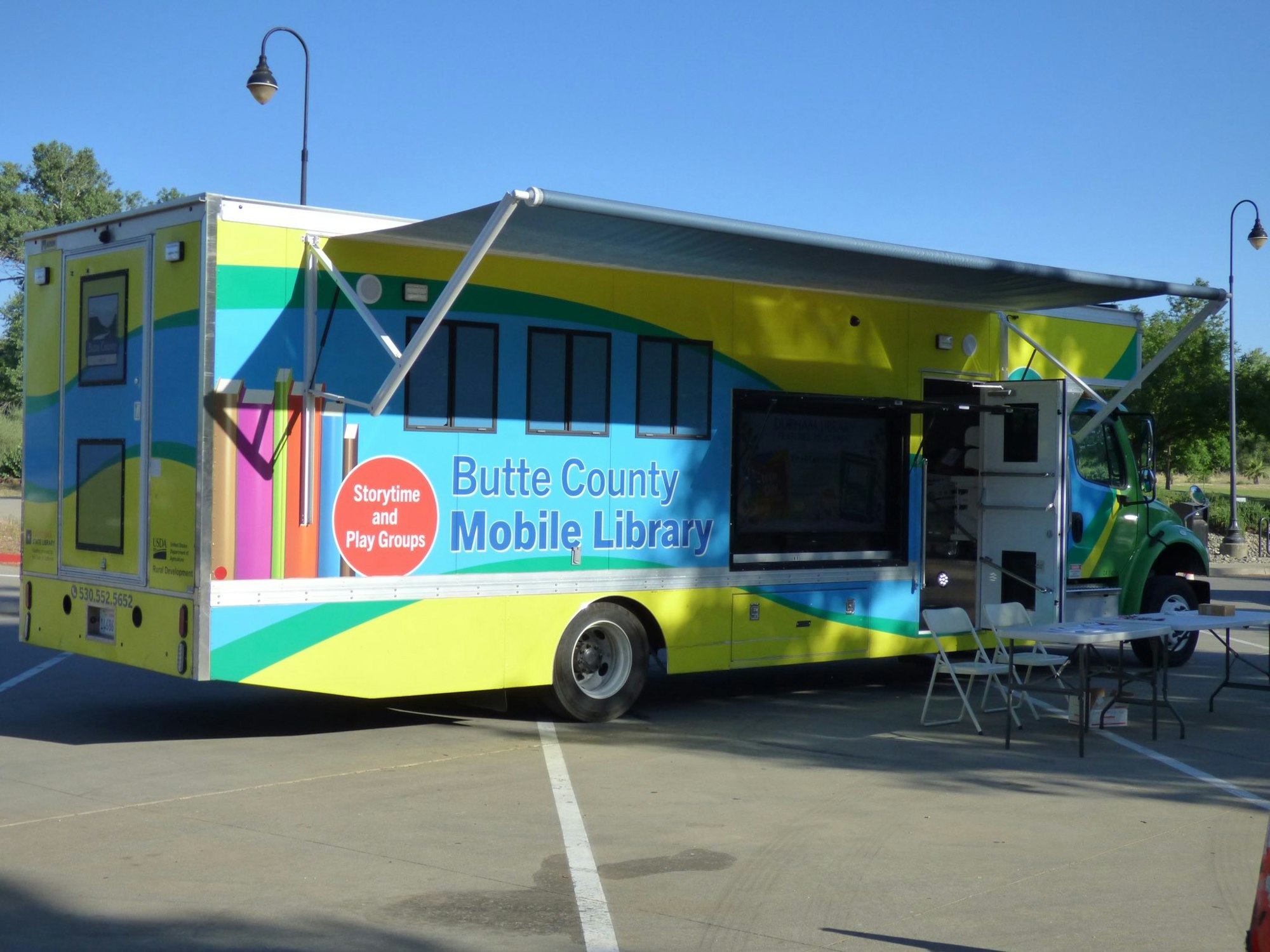 Mobile library truck labeled "Butte County Mobile Library" offering storytime and play groups.