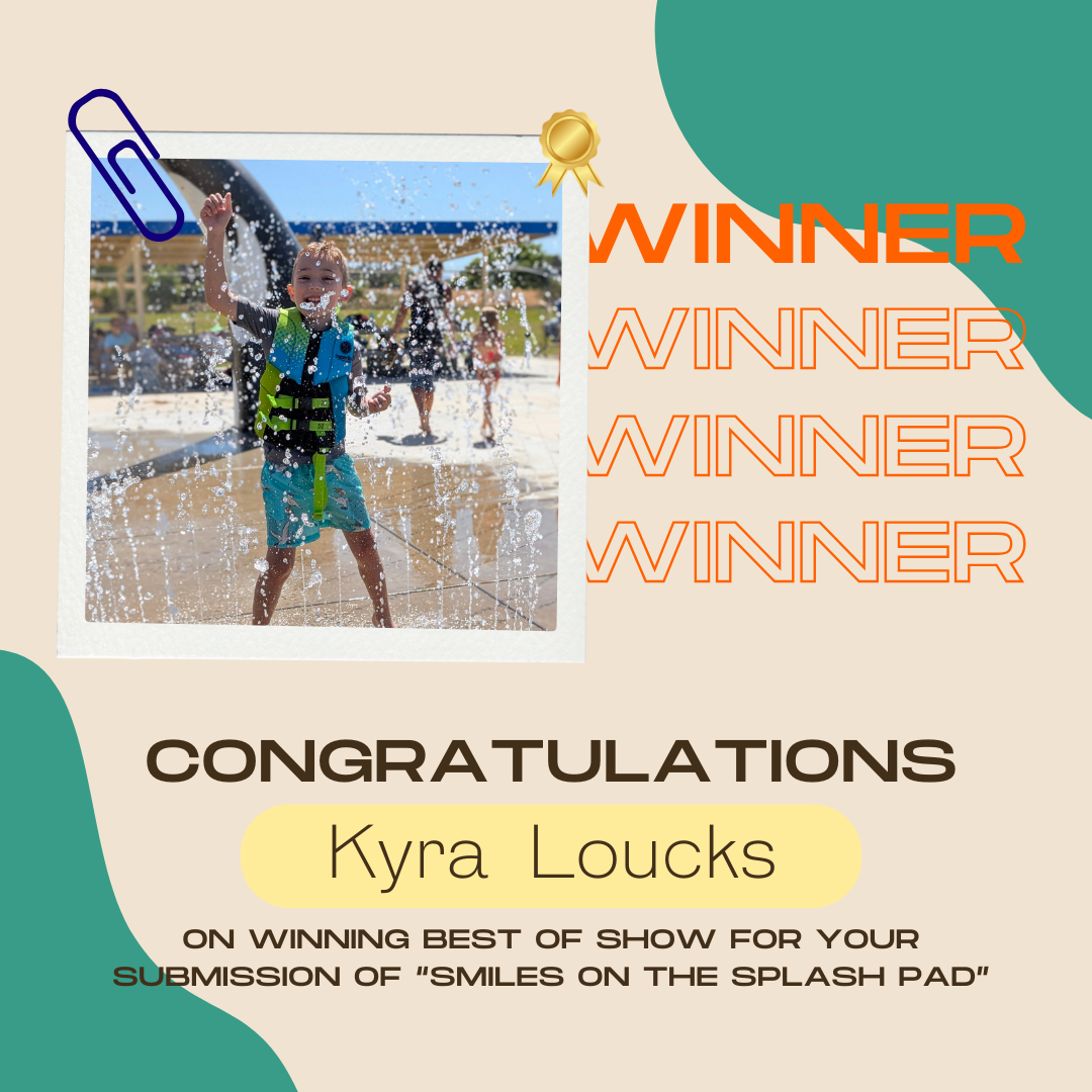 A child playing in a splash pad won "Best of Show" for the "Smiles on the Splash Pad" submission.