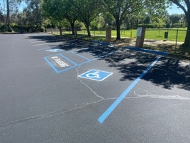 Empty parking lot with disabled parking spaces.