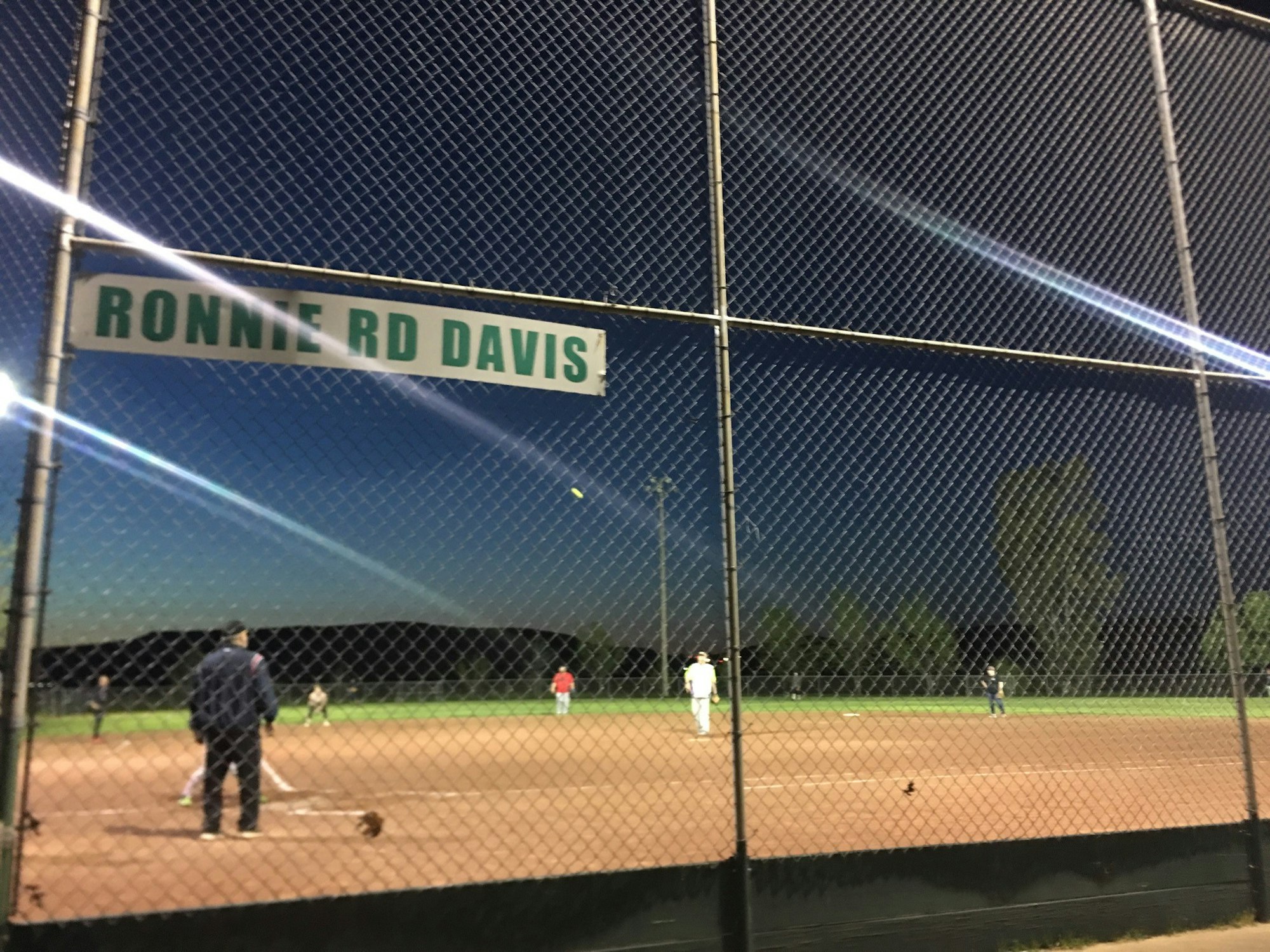 May contain: person, human, building, people, team, sport, sports, team sport, arena, field, baseball, baseball field, and softball