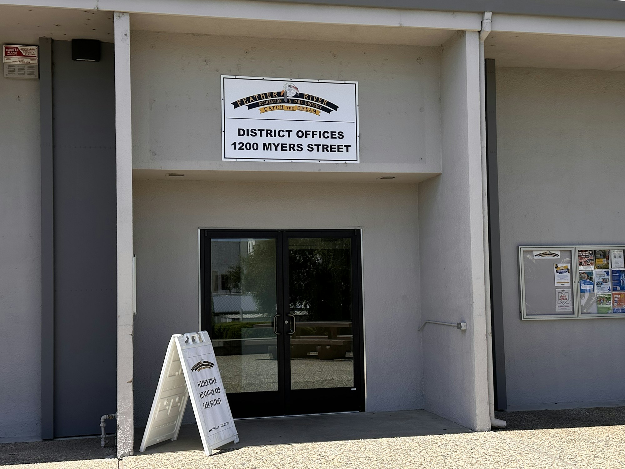Entrance to district offices at 1200 Myers Street with a sign and bulletin board.