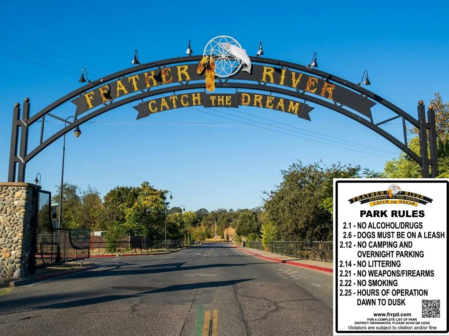 Entrance archway to Feather River, "Catch the Dream," with park rules on display: no drugs, leashes required, no camping, no weapons.