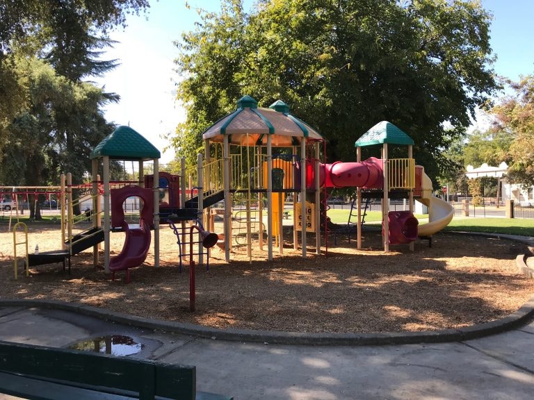 May contain: vehicle, transportation, car, automobile, playground, and play area