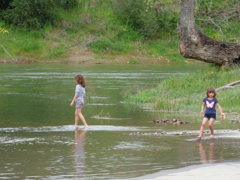 May contain: person, human, clothing, shorts, apparel, water, nature, outdoors, and play