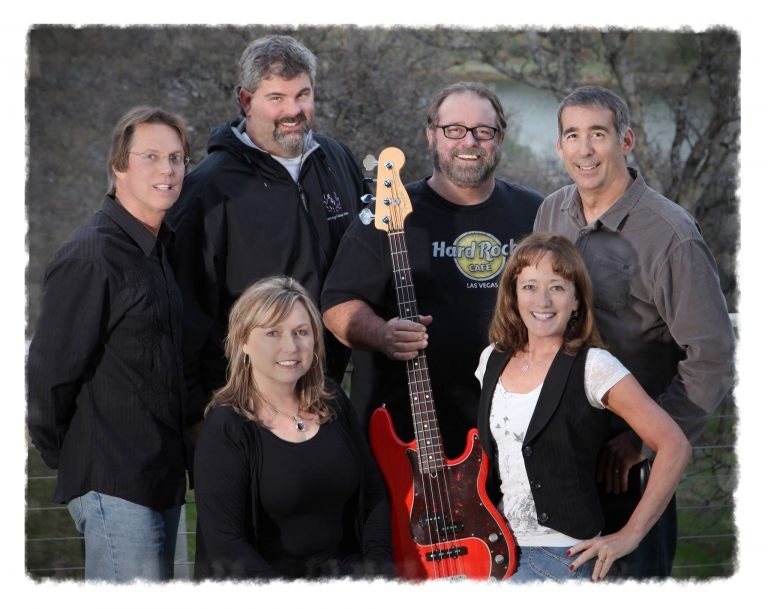 May contain: person, human, musical instrument, guitar, bass guitar, and leisure activities