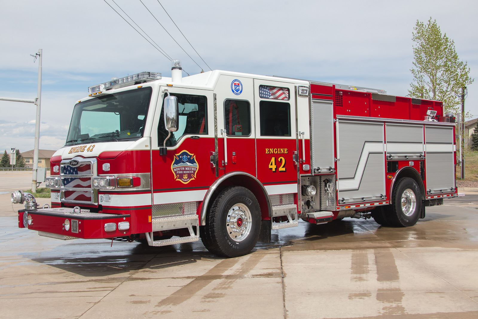Red and white fire truck labeled "Engine 42" with "South Metro Fire Rescue" logo.