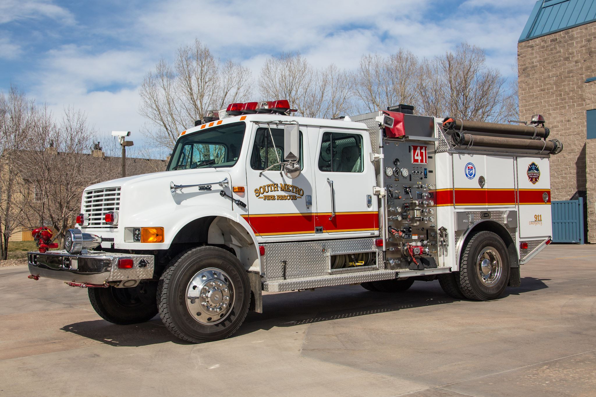 A white fire truck with "South Metro Fire Rescue" on the side, parked outdoors.