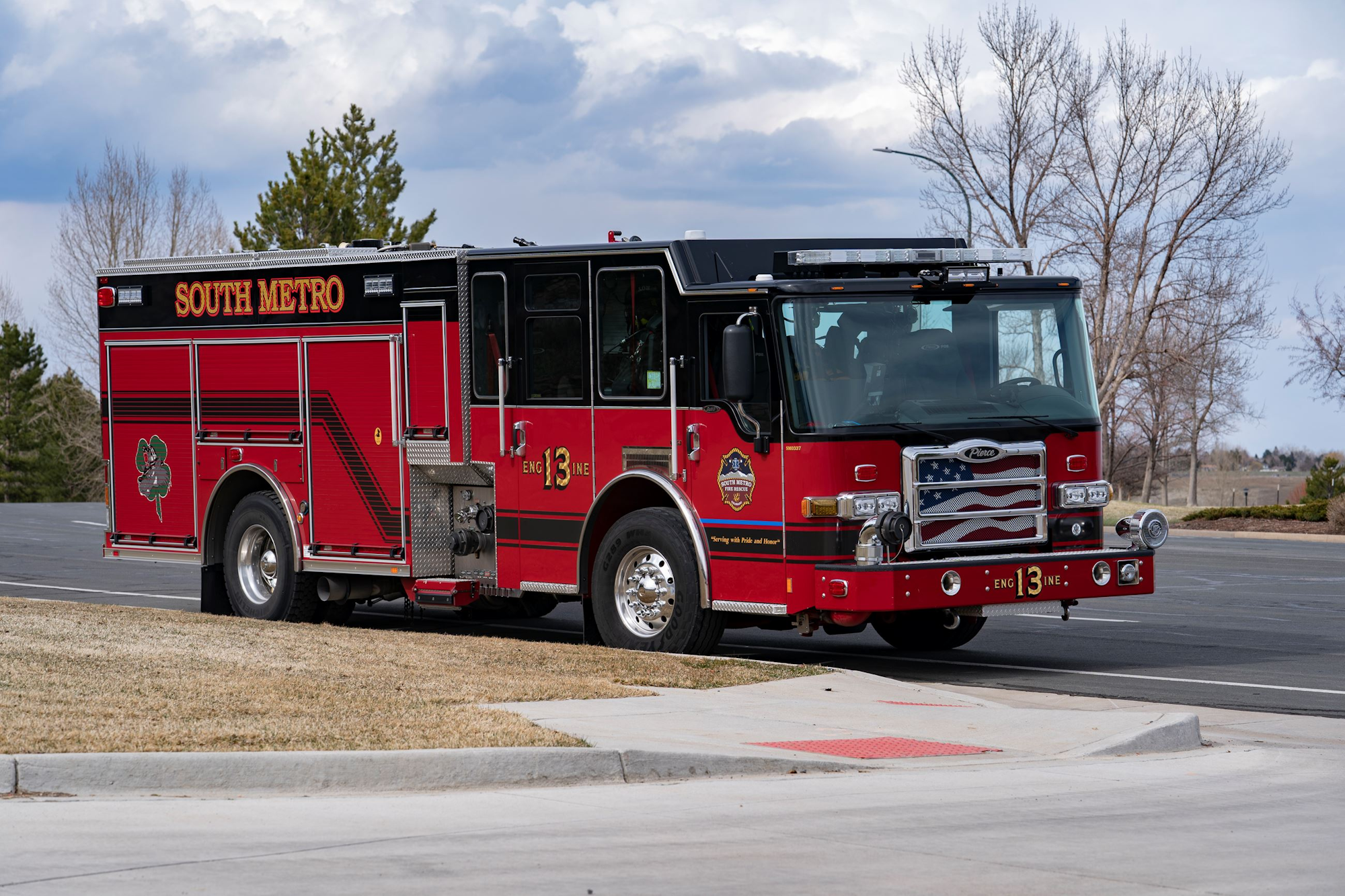 A red fire truck labeled "SOUTH METRO" and "ENGINE 13" with an American flag detail on the front.