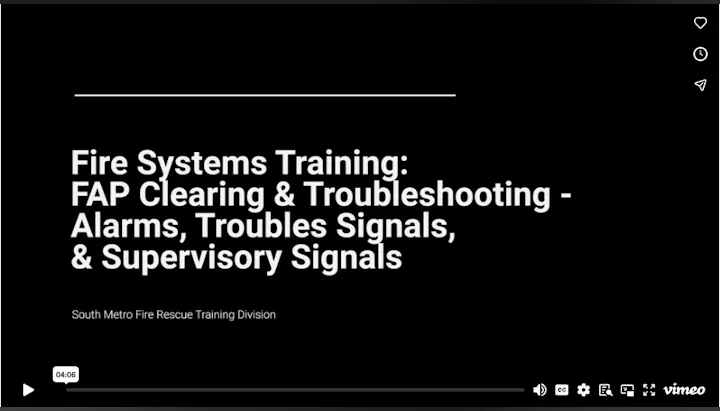The image features a title screen for a fire systems training video focusing on alarms, trouble signals, and supervisory signals.