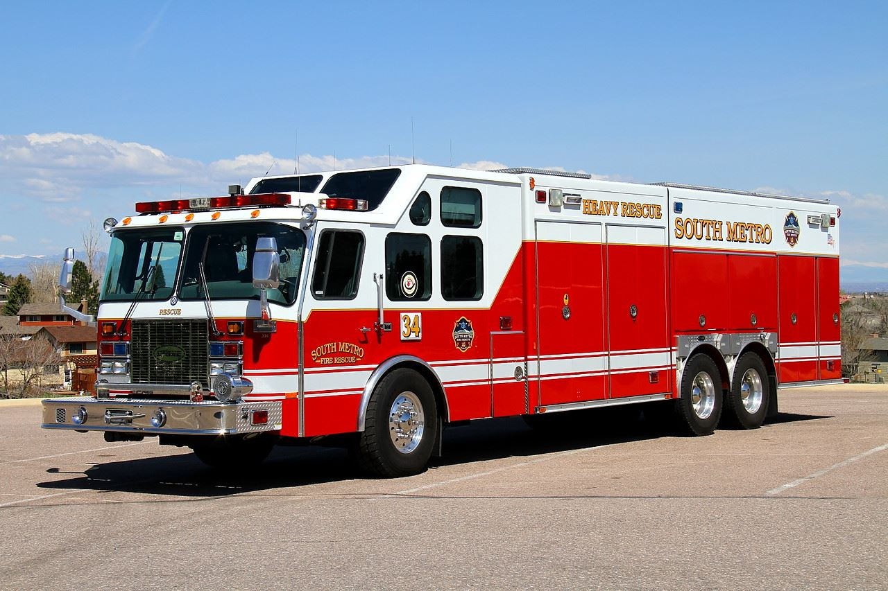 A red and white fire rescue vehicle labeled "South Metro Heavy Rescue," parked outdoors.