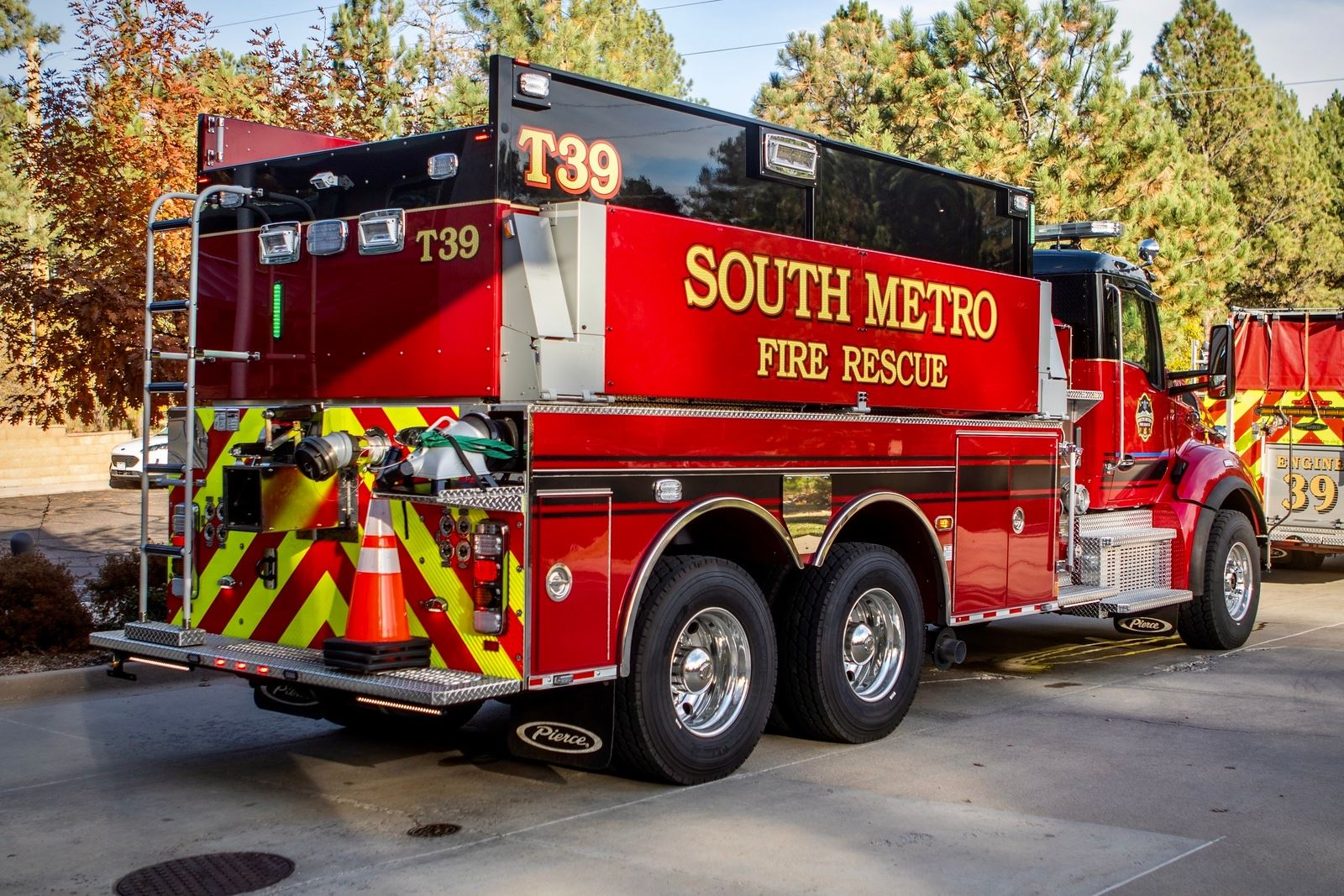 Red fire rescue truck labeled "South Metro Fire Rescue" with T39 markings parked outdoors.