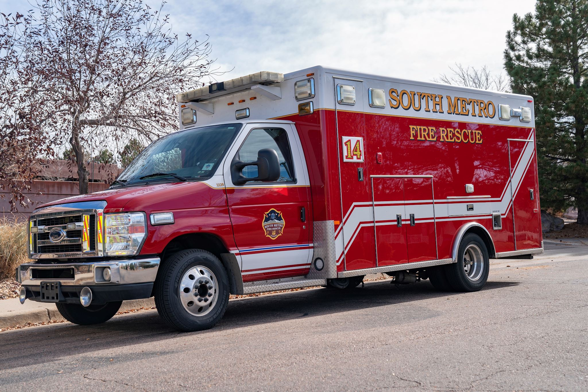 Red fire rescue truck parked on a street, labeled "South Metro Fire Rescue 14."