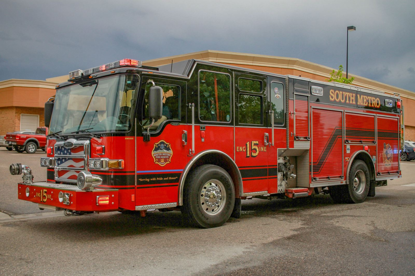 A red South Metro fire truck parked on a street.