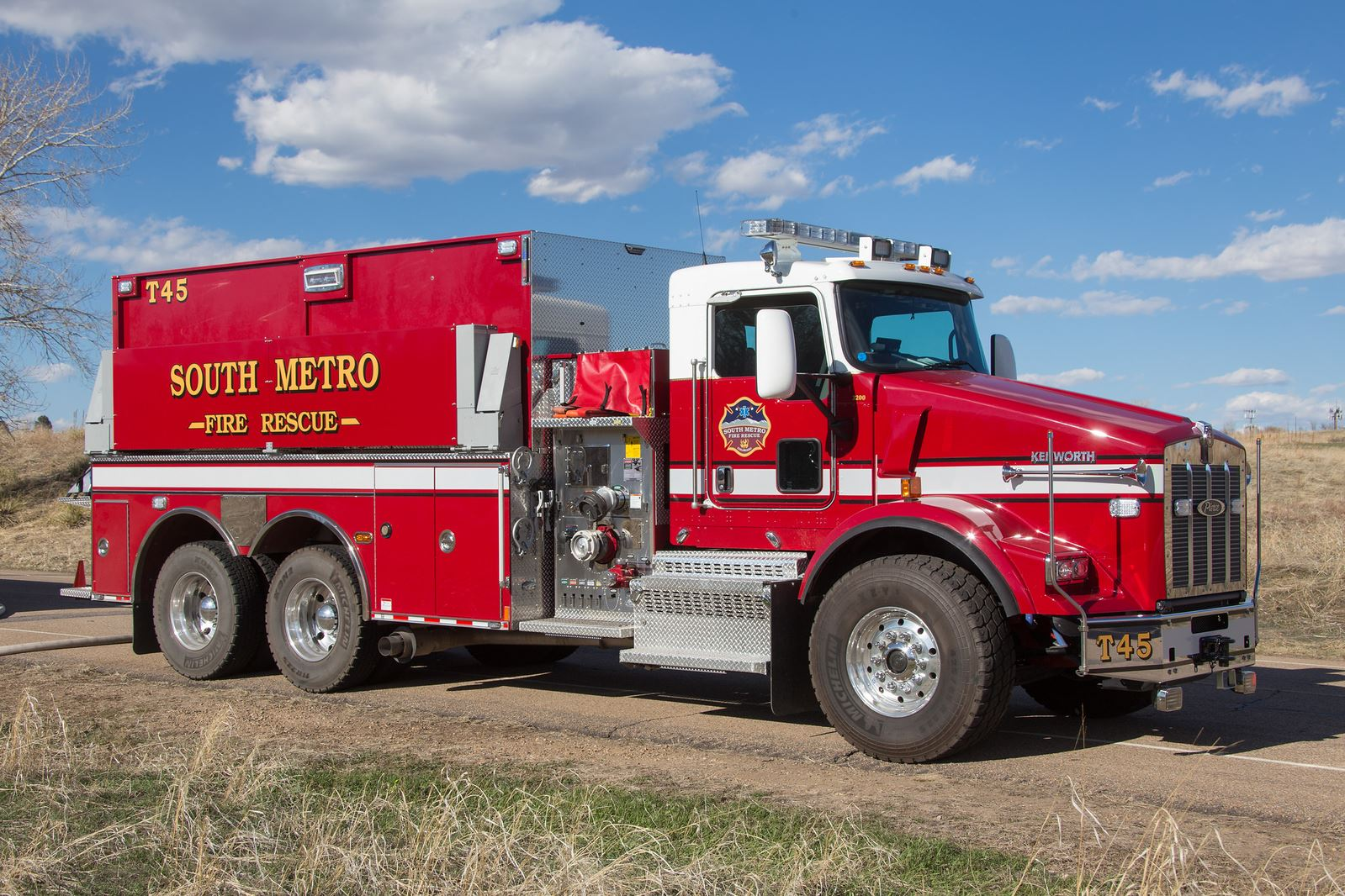A red fire rescue tanker truck labeled "SOUTH-METRO FIRE RESCUE" parked on a road.