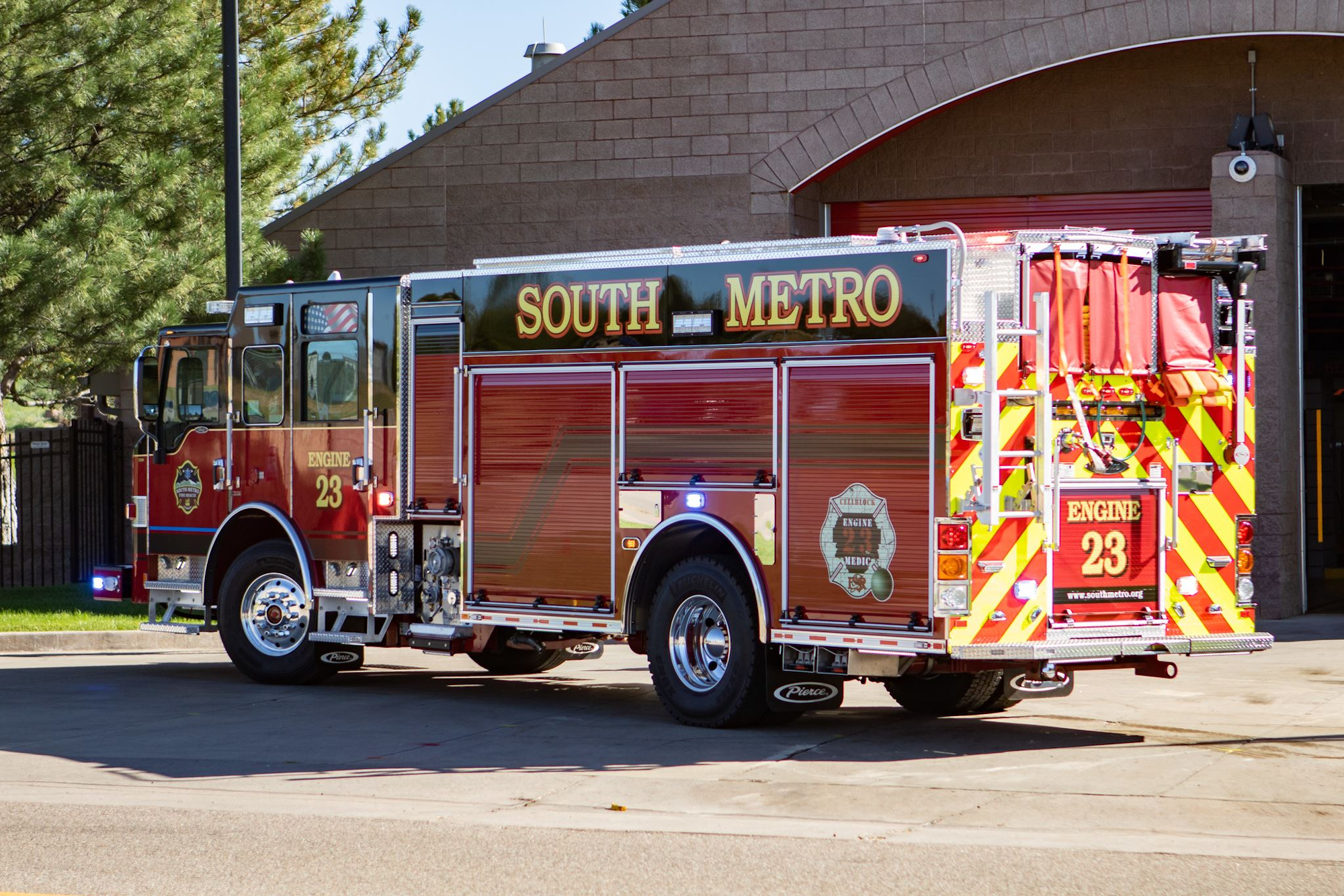 A South Metro fire truck, labeled Engine 23, parked near a fire station.