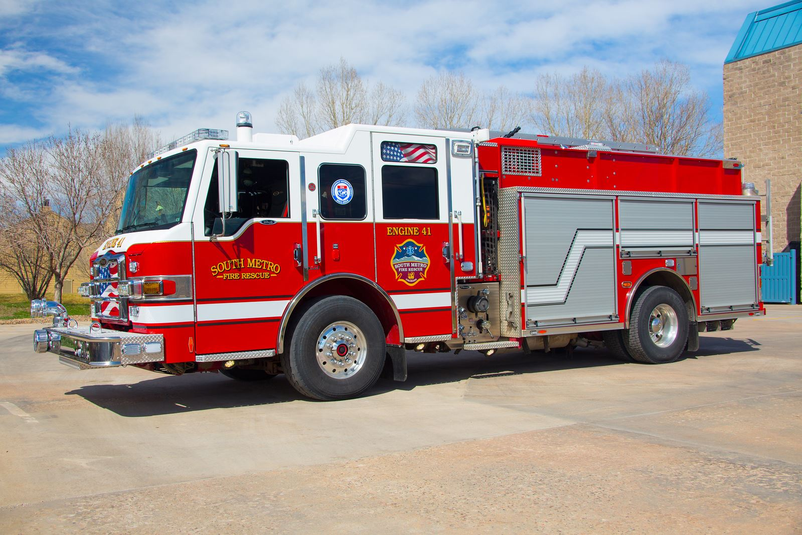 A red and white fire truck labeled "South Metro Fire Rescue" parked outdoors.