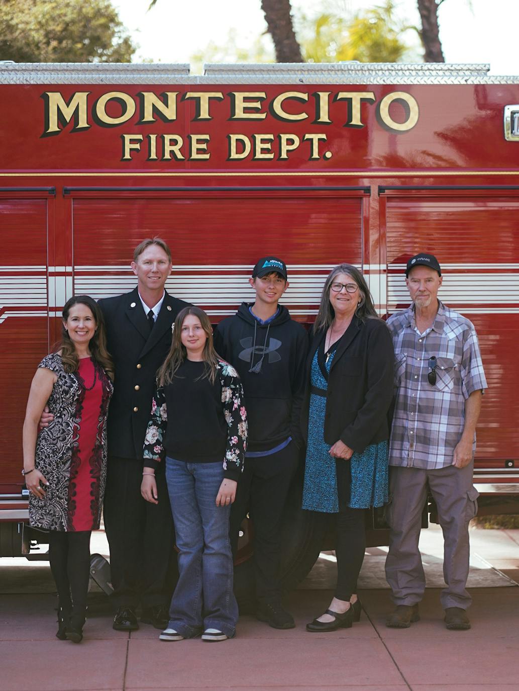 A group of six people standing in front of a Montecito Fire Dept. truck.