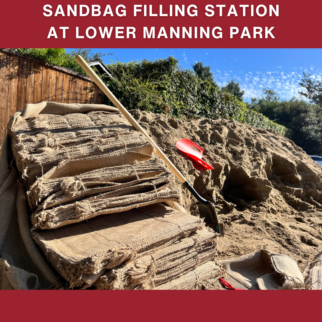 Sandbag filling station with shovels and empty sandbags at Lower Manning Park.