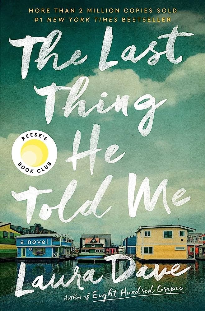 Book cover: "The Last Thing He Told Me" by Laura Dave, featuring houses on water and Reese's Book Club logo.