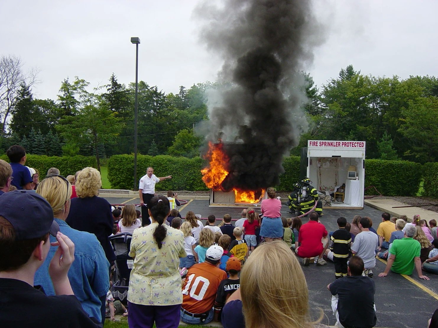 people watching a fire