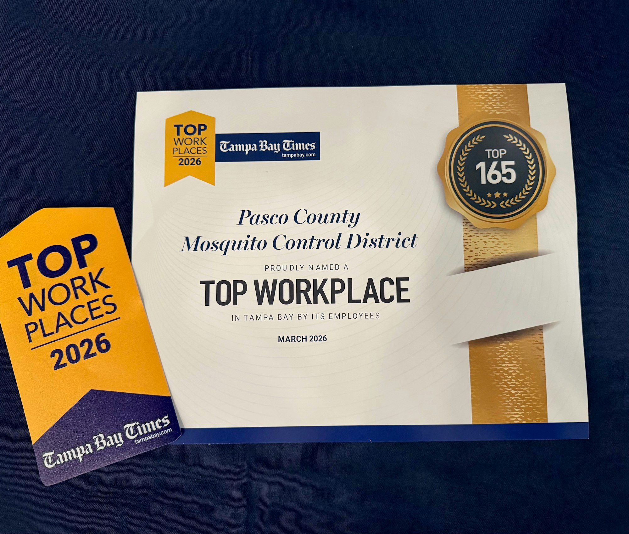 A certificate recognizing Pasco County Mosquito Control District as a Top Workplace in Tampa Bay for 2026.