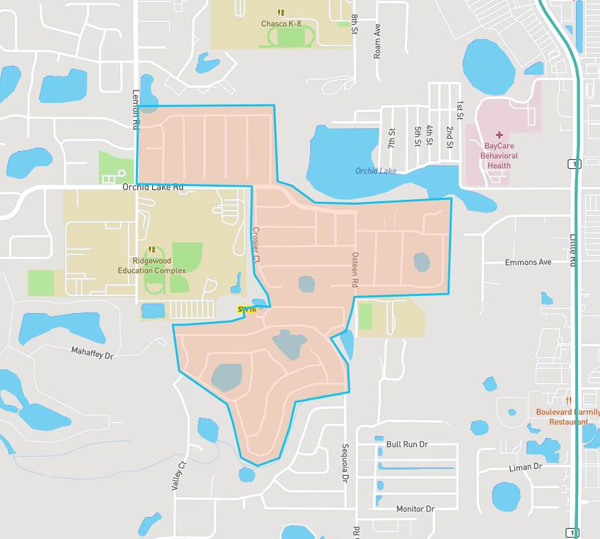 The image shows a map section highlighting neighborhoods, roads, schools, and water bodies in a suburban area.