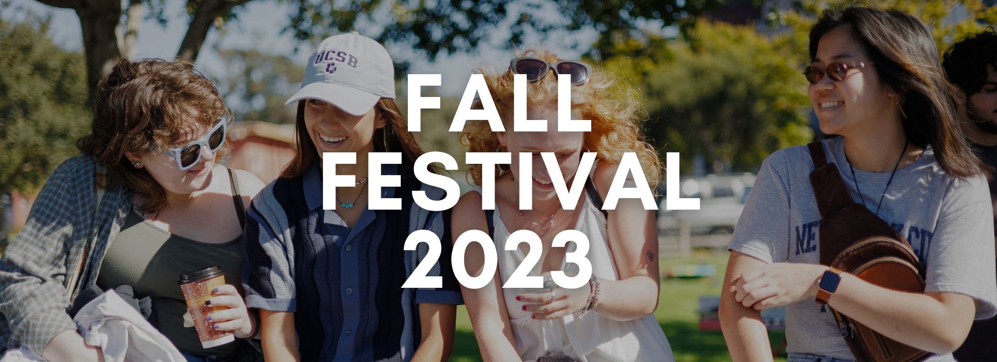 People smiling at a Fall Festival 2023 event.