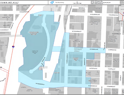 Map highlighting a tax boundary in downtown Colorado Springs, showing streets and notable areas within shaded regions.