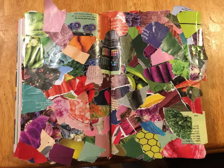 A creative collage in a book made of colorful paper cutouts, featuring various shapes, colors, and images.