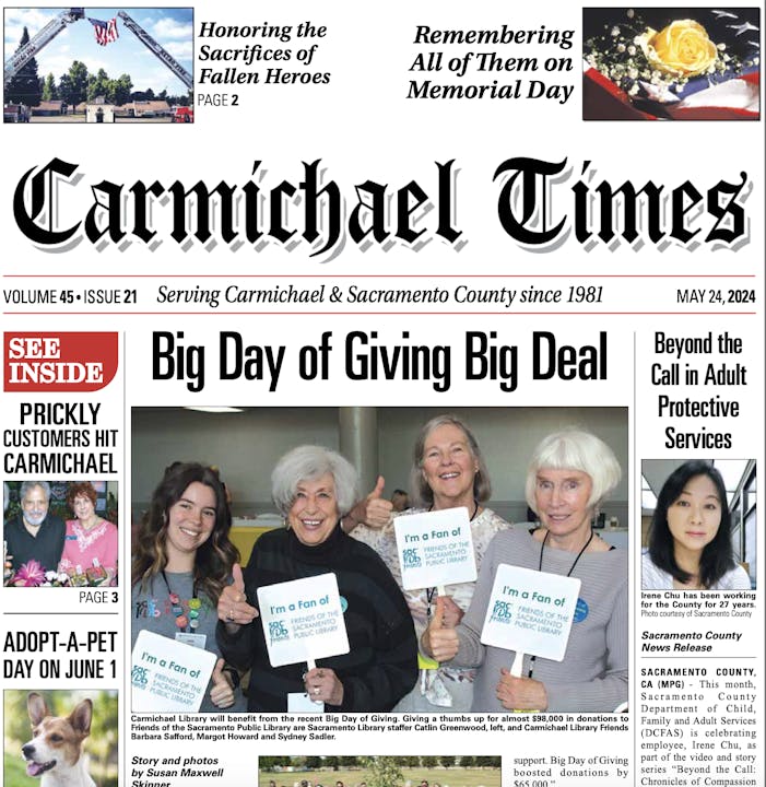 A newspaper front page with headlines about community events, an image with smiling women holding signs, and a feature about adopt-a-pet.