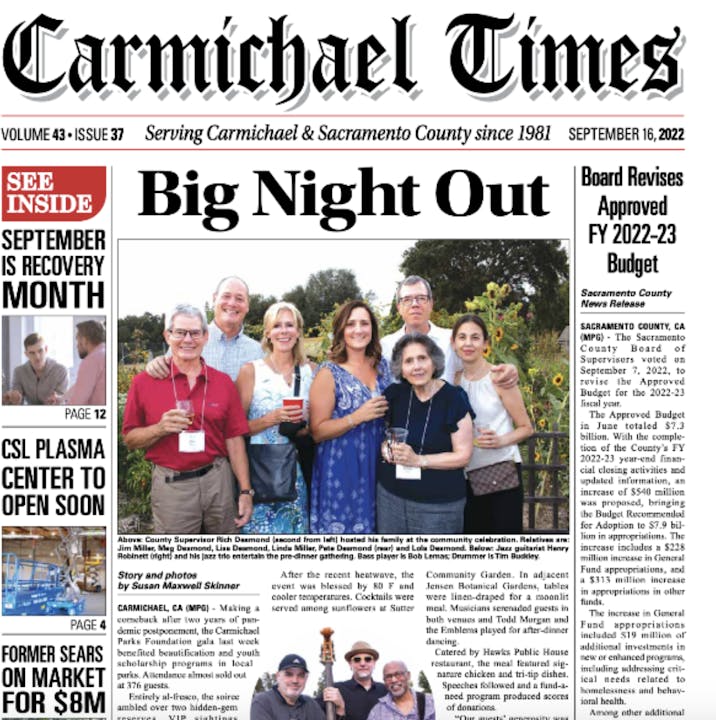 Front cover of Carmichael Times newspaper with headlines, group photo, and smaller articles.