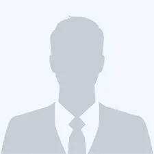 Silhouette of a person wearing a suit and tie, with a neutral background.