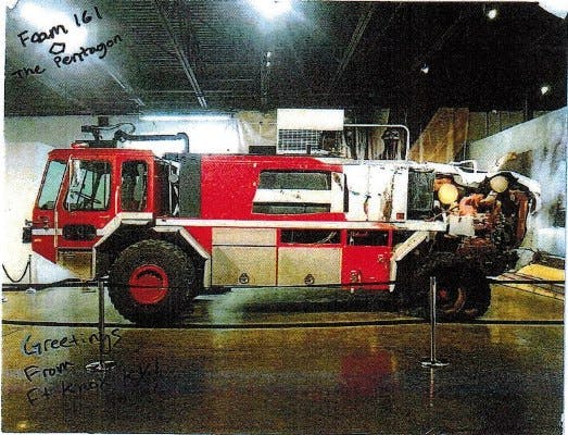 9-11 Memorial showing  ENG 161 From The Pentagon at an indoor exhibit.h handwritten greetings on the bottom.