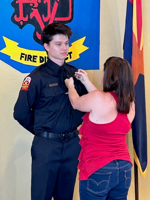 Firefighter Gilbert receives his badge 07-24-25