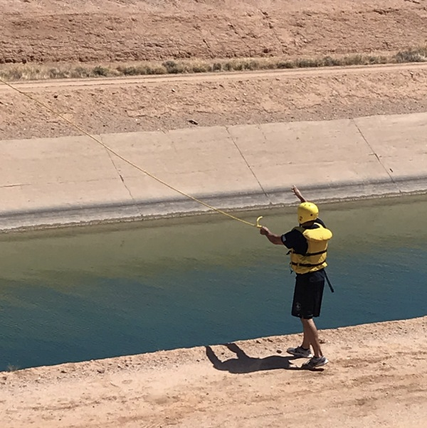 May contain: clothing, vest, lifejacket, person, outdoors, and water